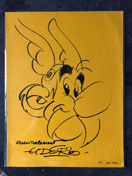 Asterix cheerful, with Uderzo's famous block capital signature
