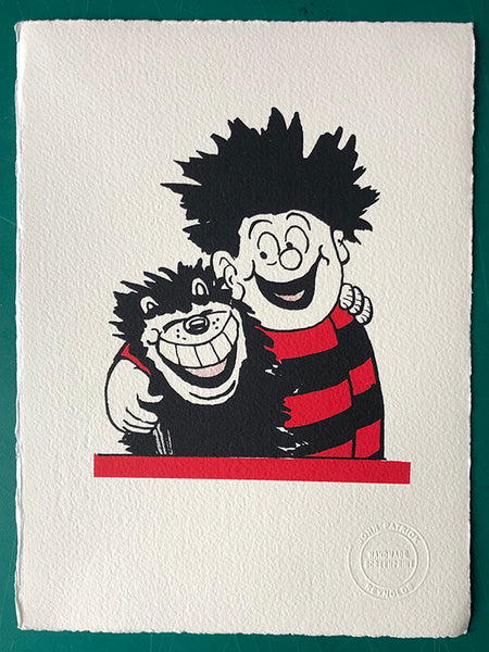 Dennis the Menace and Gnasher share a hug