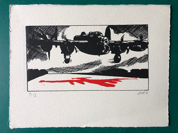 A Lancaster bomber takes off in the moonlight